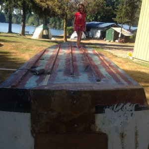 Media 'now the work can begin, anyone that has done bottom work can appreciate a boat upside down.
Its like working at a workbench.' in album 'Cabin removed from hull, took 3 of us to carry it there'