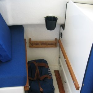 Mini-shelf added next to port and starboard seats