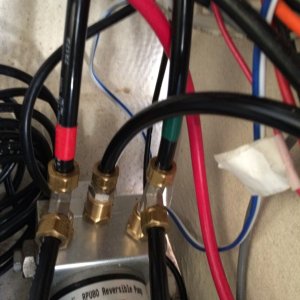 Media '12V DC motor, controlled by autopilot computer, drives hydraulic piston mounted on Nisson.  Two lower hoses go to helm pump for manual control of Nisson.' in album 'Helm pump for hydraulic steering'