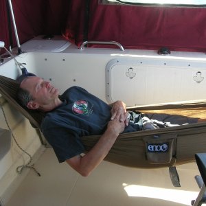Yep, an ENO ProNest hammock strung between the 2 stern cleats - which have strong backing plates.  I'm 5'8" tall (or short) and fit fine.