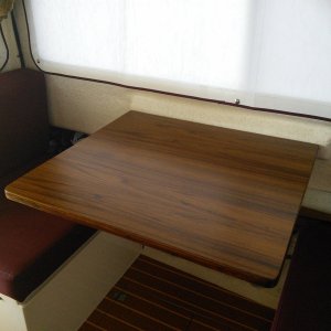 Used the original dinette table and simply covered it with veneer.  Then applied 6 coats of marine varnish.