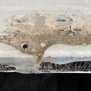 the leaks came from under the hinges where the caulk had not quite spread out all the way to create a seal