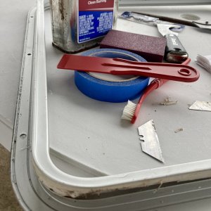 While the balsa was airing out and I waited for an order of epoxy I set to clean all the caulk residue from the hatch frame .