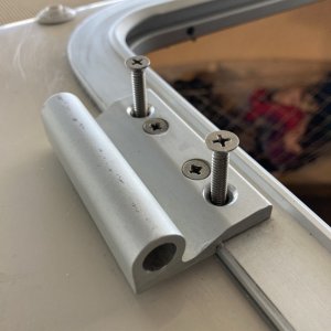 The hatch was previously fastened with wood screws (they only threaded the top layer of solid fiberglass and dug into the balsa core. I replaced them all with machine screws washers and nyloc nuts.