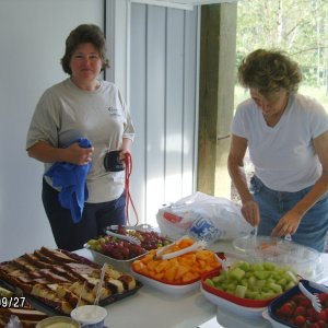Jackie and Sandra helping setup fruit