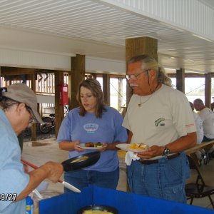 Paula cooking, Carrie and Ashely getting breakfast.