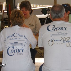 Anne & Doug with the new shirts and old shirts.