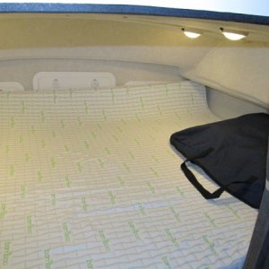 berth with topper from amazon.com.  Marinebeam 18-LED lights.  Cabin 9 white, 3 red LED provide what E calls "that New Amsterdam Bordello effect" for when you want that.