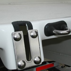 Sooner or later, we'll be towing something or someone.  A Wichard towing eye to R. of Dive Ladder bracket. Sailboat gear but very heavy duty.