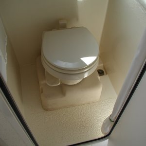 Media 'The familiar SeaLand "Traveler" toilet.' in album 'Sooner or later, we'll be towing something or someone.  A Wichard towing eye to R. of Dive Ladder bracket. Sailboat gear but very heavy duty.'