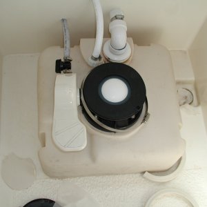 Bowl removed, new gasket in place.  No sewage is seen or contacted during this procedure! New valve seen behind foot pedal.