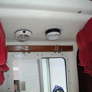 Media 'To the R. of the light, a Nicro Solar powered exhaust vent. Key to a fresh smelling head! Thanks to Bob of SeaPal for suggestion.' in album 'Sooner or later, we'll be towing something or someone.  A Wichard towing eye to R. of Dive Ladder bracket. Sailboat gear but very heavy duty.'
