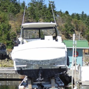Bayliner on precarious boat lift in the slip behind me.