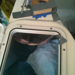 Battery/switch covered and bag taped in to collect debris. Quickly made jig with a 2 1/2" hole at a 65 deg angle for rod mount. I recommend the jig instead of eyeing the needed angle as the instructions indicate.