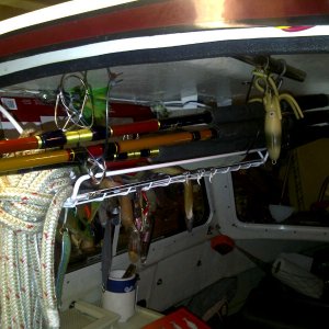 Home Depot shelf hangs jigs & rods above table