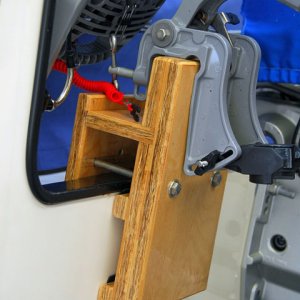 Honda 2 HP bracket with engine, closeup.