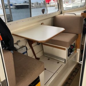 Port seating was sunbrella cloth.  14 years and kerosene heat and stove took their toll