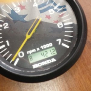 Old tach with engine hours.