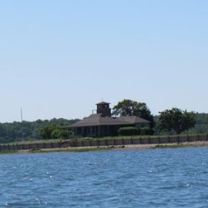Nice place on Coecles Harbor might be able to get vehicles there using the sand spit that runs behind the house