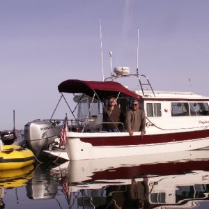 Pat and Patty on Daydream - Baxter in Dinghy