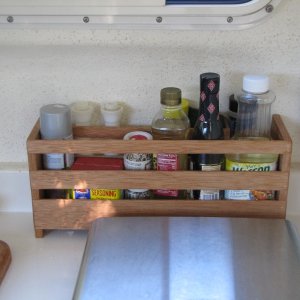 Media 'This one behind stove to hold cooking supplies.' in album 'Hook to hold window curtains when not in use.'