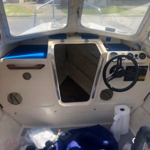 Holes cut for new speakers, new radio and USB port. Also changed the wiring ports behind the controls on the starboard side.