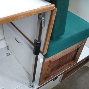 Note: The storage hatch cover Hinge was moved to the left so the box can slide back and a tab was added inside the hatch to support the lid. Also, I used some left over latch parts on the floor, this keeps the table leg from sliding backward. Also added a pad on the leg for the table to rest against.