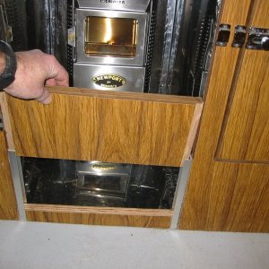 The door and lower kick panel come off for unobstructed air flow. The heater has a 12 volt fan. (Rock-C)