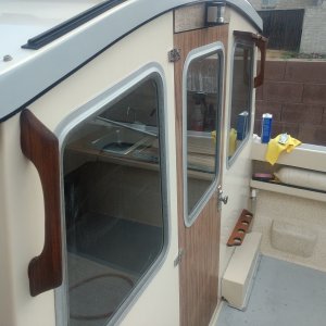 Fishing rod rack and grab handles back on. Almost finished buffing the the bulkhead. I'm tired of buffing now. :-(