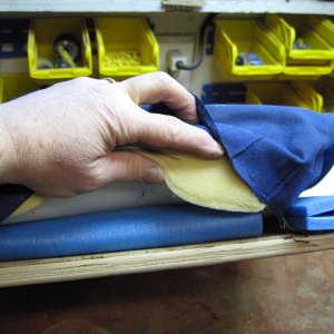 Media 'Two layers of sleeping bag pad down the middle' in album 'Get under the staples with screwdriver then pull with pliers.'