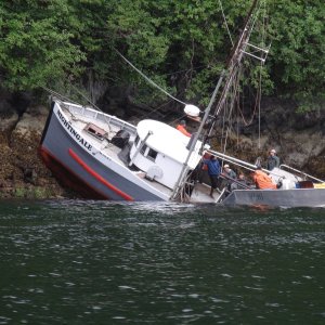 The fishing boat "Nightengale" on the rocks