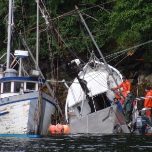 Working to get her free & afloat