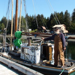 Port Alexander. Very small wooden fishing boat built in 1930 the owner shown here brought up from Port Townsend, Washington