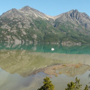 Glacier river silt blending into Atlin Lake