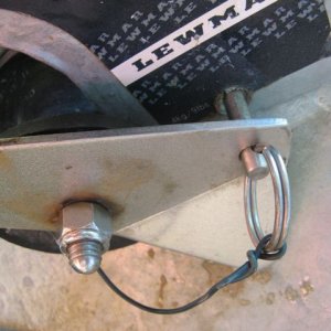 Close up of holes drilled in bow roller and anchor shank