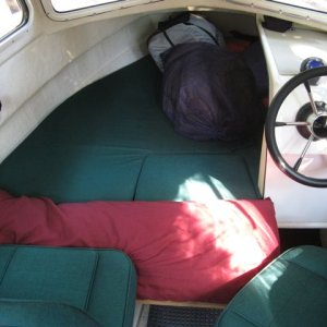 Cushion in place on berth extension. Very comfy! Width is approx 39" (single bed size) across extended section. Length about 7 feet.