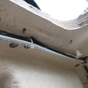 Two trim screw holes where water was comming thru the deck from hatch lack of bedding