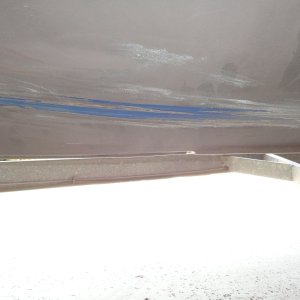 area where bottom paint worn off by trailer bunk loading