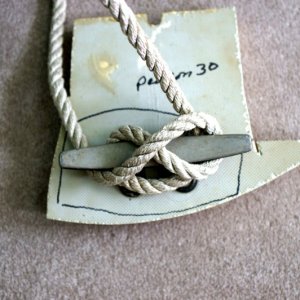 around 2 legs and under two horns.  Figure 8