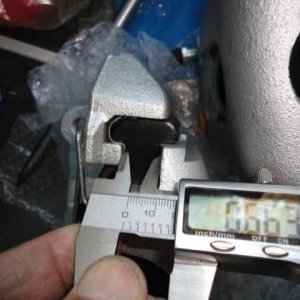 This is the only one of the 4 caliper castings which allowed the brake pad backing to come into its recess
