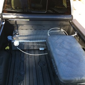 Media '35 gallon aux diesel tank, Truxedo tonneau cover, rolled up, and storage box' in album 'In driveway'