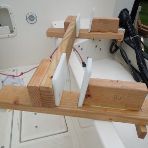 2x4s, a little glue, some self-tapping deck screws, left over cutting table material, and a few coats of spar Varathane.
