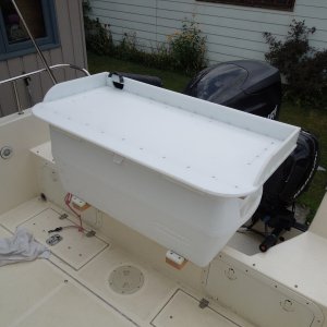 We went through some instance weather this summer, buried the bow numerous times on one occasion; cooler stayed secure.