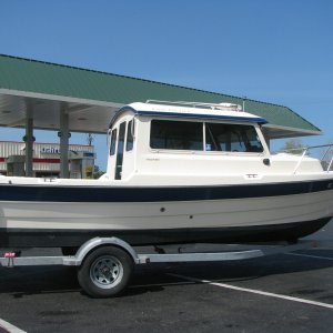 Stopping for gas another shot of Bayliner trailer I've upgraded to tandem axcel alum. trl. with disc brakes