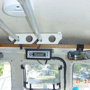 Looking up at  the shelf it holds am/fm  cd radio ,plus rod holders or boat hooks. the cape cruiser has a shelf but   no headliner like the venture.