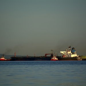 Another tanker being docked at the refinery