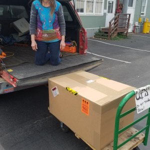 Dana loading up the huge Spectra watermaker box.