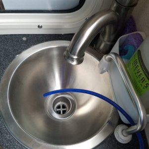 Finally finished with the watermaker! This is the blue test water outlet line. The initial output is tested for salinity until it has almost 0 salt before routing the drinkable water forward to the water tank.