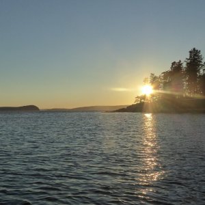 Media 'Sun setting, looking towards East Sound entrance' in album 'After a Friday night aboard hoping to get an early start Saturday, but instead woke up to morning fog. Looks like Catman is heading out too!'