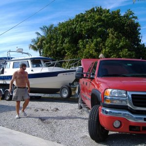 Jim is fixing the rutts he made in the drive....some people.